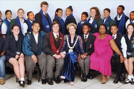 Overstrandâ€™s 2014/2015 Junior Town Council in the company of the Mayor Nicolette Botha-Guthrie and JTC Manager Unity Mtomile. From Hawston Secondary School: Elgermine Fourie (Deputy Jnr. Mayor), Shani Arendse, Sherilene Botha, Reagan Fortuin, Jenny-Lee Hartnick, Agnesia Konstabel and Alfonso Williams (Executive Member). From Hermanus High: Natalie Austin (Executive Member), Elani Groenewald, Amy Hess, Misha van Zyl and Monique Vermeulen (Executive Member). From Qhayiya Secondary School: Jennifer Funda (Executive Member), Zizibele Gashe, Botleng Kayeki, Nezisa Mgqeba,  Zubenathi Sofute,  Athini Tshwalakhe  (Executive Member) and Norman Zininga. From Gansbaai Academia: Johan van der Merwe (Jnr. Mayor), Analo Yawa (Deputy Jnr. Mayor), Marcel Colleen Dickson, Stefan Joubert, Jemaine Jack Julies, Amy Thandi Wolhuter and Khanya Xhalisile. From Northlink College: Nicole Blignaut, Hope Botes, Matthew Jones and Ignesius Matema (Executive Member). From Curro Hermanus: Inez Mallandain (Executive Member) and Tyde-Summer Turck.